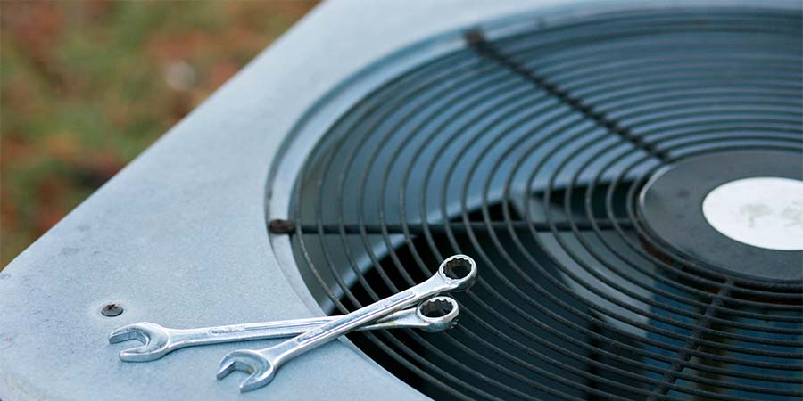 AC unit with wrenched on top